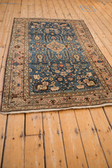 Vintage Arak rug shown from a high angle, displaying its full medallion design and floral borders.