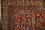 A close-up of the antique Malayer rug's corner shows the henna plant and serpent borders.