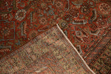 Antique Malayer rug corner folded back, revealing the hand-knotted foundation and low, even pile.