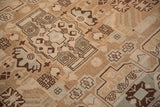 Geometric vines and blossoms in distressed vintage Hamadan rug's sand, beige, and slate pile.