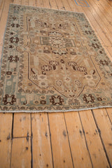 Distressed fringe, meandering floral border, and even wear on a vintage Hamadan rug.