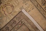 Back of an antique Karabagh rug showing its hand-knotted foundation and restored side cord.