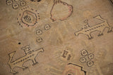 Hand-knotted pictorial motifs of lion-like animals on a distressed antique Armenian rug.