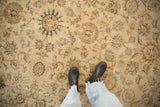 Even wear across the soft pile of a distressed Kashan, showing floral scrolls and palmettes.