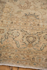 Close-up of the vintage Kashan carpet's border, showing even wear and low pile texture.