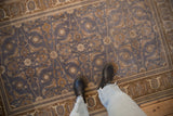 Distressed blue Sivas rug featuring inverted Herati motifs and brown Turtle Samovar border.