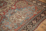 The reciprocating wave design border alongside geometric guls on an antique Caucasian Soumac carpet.