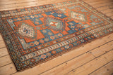 Antique Caucasian Kazak border details: madder red, sapphire blue, geometric relief, intact selvage.