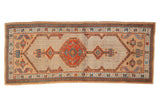 Vintage Persian Serab runner with a central red medallion and geometric motifs on a camel ground.