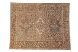 Vintage distressed Karaja rug with three geometric medallions in sand, beige, and dusty ocean green.