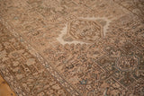 Detailed view of the Karaja rug's mostly even wear, showing geometric motifs in sand and dusty blue.
