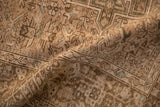 A soft fold reveals the distressed texture and low hand-knotted pile of the vintage Persian rug.