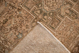 Vintage Karaja rug corner folded over, displaying the low pile and hand-knotted foundation.