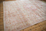 Faded floral and arabesque pattern with mostly even wear on the distressed vintage Kaisary carpet.