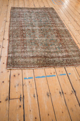 Distressed vintage Hamadan runner detail: worn pile, dusty blue, pale rust Herati pattern, fringe.