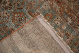 Distressed vintage Hamadan rug, showing hand-knotted foundation, worn pile, and orange cording.