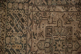 Vintage distressed Karaja carpet detail with hook and latch and serrated leaf motifs.