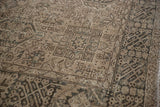 Distressed Karaja geometric motifs in pale coffee brown, showing even wear.