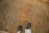 Distressed vintage Bijar rug showing roundel medallion and dusty teal Herati patterns.