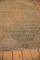 Distressed vintage Bijar rug pile, dusty teal Herati pattern, faint foundation showing through.