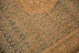 Distressed vintage Bijar rug's dusty teal Herati pattern with visible knot heads.