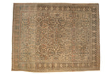 Vintage distressed Lilihan carpet with sprawling floral sprays in muted blue and terra cotta over a cream field.