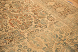 Mostly even wear across the knot heads of a vintage Lilihan carpet's floral field.