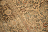 Mostly even wear across the knot heads of a distressed vintage Persian Lilihan carpet.