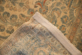 The hand-knotted back and intact side cord selvage of a vintage Persian Lilihan carpet.