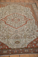 A detailed view of the antique Malayer's even, low-pile texture, revealing the hand-knotted foundation.