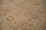 Detail of palmettes and small birds on the distressed, low-pile of a vintage Tabriz.