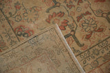 Back of the vintage Tabriz rug showing its hand-knotted weave and intact side cord selvage.