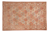 Vintage distressed Bakhtiari carpet with a diamond lattice pattern in pomegranate red, dusty blue, and antique ivory.