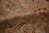 Time-softened pile and muted pomegranate red motifs on a folded vintage Bakhtiari rug.