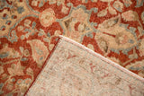 Tightly woven foundation and worn pile of a distressed vintage Persian Tabriz carpet.