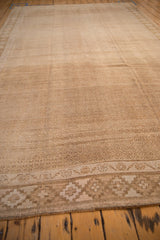 Long perspective view of a vintage Kars rug, showing its sandy low-pile texture and horizontal abrashes.