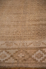 Detailed texture of the hand-knotted, short pile on a distressed Turkish Kars carpet.