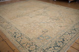 Distressed Heriz rug corner with dusty teal border and Turtle Samovar Herati pattern.