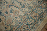 Angled detail of the Mahal carpet's Herati pattern in dusty teal, terracotta, and ivory.
