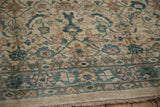 Soft, even pile of a Mahal carpet with a Herati motif in dusty teal and pale terracotta.