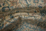 The supple hand-knotted pile of a Mahal carpet shown in soft, textural folds.