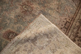The back of the distressed Mahal rug, showing the tidy hand-knotted foundation and machine-bound edge.