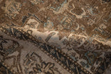 Distressed texture of vintage Isfahan rug, showing exposed foundation and muted beige pattern.