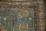 Antique Malayer rug corner detail: dusty sky blue field, stylized guls, chestnut rust boteh border.