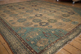 Antique Persian Malayer rug corner detail, highlighting dusty sky blue spandrel with partial Herati motif.