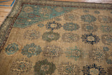 Antique Malayer rug detail: trident floral guls on a tone-on-tone lattice in beige, blue, and brown.