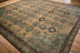 Antique Malayer carpet corner displays dusty blue Herati spandrel, beige field, vine borders.