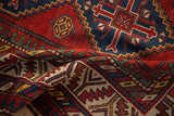 Detailed view of the reciprocating pawn design and even pile of an antique Kazak runner.