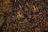 Close-up of seated human figures and boteh motifs on an antique pictorial Farahan Sarouk rug.