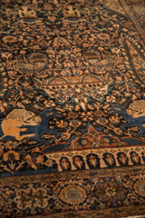 Close-up of the pictorial hunting scene with a lion motif on an antique Farahan Sarouk rug.